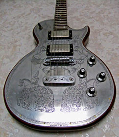 Degay Guitars - detail of 6-string electric metal front with knights engaving